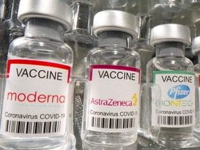 Vials labelled "Moderna, AstraZeneca, Pfizer - Biontech coronavirus disease vaccine" are seen in this illustration picture taken May 2, 2021.