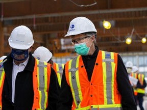 Rod Phillips, right, Minister of Long-Term Care, tours the construction site for two long-term care homes at Trillium Health Partners in Mississauga on Monday, November 15, 2021.