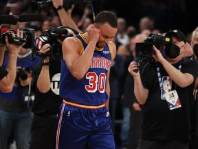 Stephen Curry of the Golden State Warriors looks on after making a three-pointer to break Ray Allen’s record for the most all-time, against the New York Knicks at Madison Square Garden on Dec. 14, 2021.