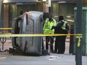 Toronto Police Traffic Services investigate a two-car collision at Yonge and Richmond Sts that sent eight people to hospital on Sunday, December 26, 2021.