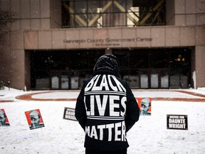 A person demonstrates in support of Daunte Wright outside the Hennepin County Government Center in Minneapolis, Minnesota, on December 21, 2021.