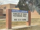 Sign at Centennial Elementary that reads 'Families of Color Playground Night, Wed 12/8 4:10 p.m.'
