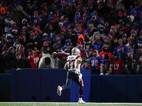 New England Patriots running back Damien Harris (37) runs to the end zone for a touchdown against the Buffalo Bills during the first half at Highmark Stadium on Dec. 6, 2021.