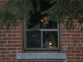 Toronto Fire at the scene of a fatal blaze at a Scarborough low-rise apartment on Pell St., southwest of Midland Ave. and Kingston Rd., on Monday, Dec. 27, 2021.