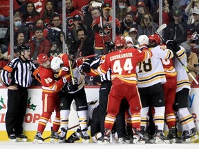 The Flames and Bruins get feisty during NHL action at the Saddledome in Calgary, Saturday, Dec. 11, 2021.