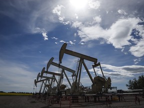 Pumpjacks draw oil out of the ground near Olds, Alta., on July 16, 2020.