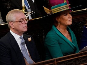 Prince Andrew, Duke of York Sarah Ferguson and Princess Beatrice of York attend of the wedding of Princess Eugenie of York and Mr. Jack Brooksbank at St. George’s Chapel on October 12, 2018 in Windsor, England. (Danny Lawson – WPA Pool/Getty Images)