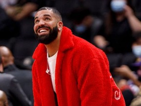 Drake attends a preseason NBA game between the Raptors and  Rockets at Scotiabank Arena in Toronto, Oct. 11, 2021.