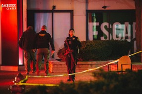 Police armed with assault rifles patrol the entrance to the Nordstrom store in Oakbrook Mall on December 23, 2021 in Oak Brook, Illinois. According to reports, at least 5 people were injured during a shootout in the Nordstrom store. (Jim Vondruska/Getty Images)