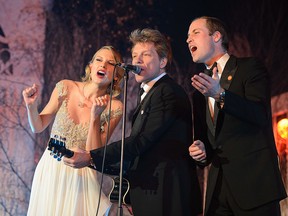 (L-R) Taylor Swift, Jon Bon Jovi and Prince William, Duke of Cambridge sing on stage at the Centrepoint Gala Dinner at Kensington Palace on November 26, 2013 in London, England.  (Photo by Dominic Lipinski - WPA Pool/Getty Images)