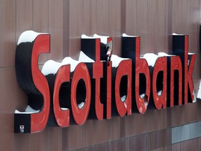 Snow covers the Scotiabank logo at the Bank of Nova Scotia headquarters in Toronto.