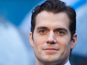 British actor Henry Cavill poses on the red carpet for the European premiere of the film Man of Steel in London on June 12, 2013. ANDREW COWIE/AFP via Getty Images)