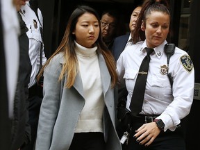 Inyoung You leaves Suffolk Superior Court in Boston, Friday, Nov. 22, 2019.