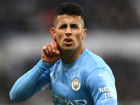 Joao Cancelo of Manchester City celebrates after scoring against Newcastle United at St. James Park on December 19, 2021 in Newcastle upon Tyne, England.
