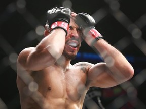 In this July 28, 2018 file photo, Jose Aldo shows emotion after a win over Jeremy Stephens (not shown) in a featherweight boutduring UFC Fight Night at the Saddledome in Calgary.