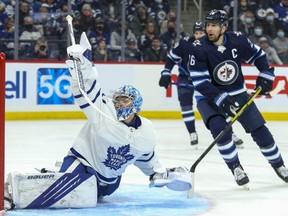 Maple Leafs goalie Joseph Woll makes a save with Jets forward Blake Wheeler looking for a rebound during the second period at Canada Life Centre in Winnipeg, Sunday, Dec. 5, 2021.
