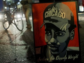 A poster of Daunte Wright is seen during a demonstration after the opening statements in the manslaughter trial of Kimberly Potter in Minneapolis December 8, 2021.