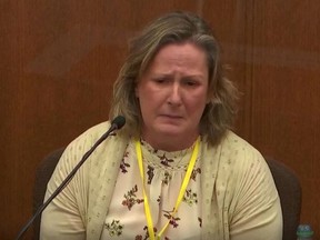 Kimberly Potter, the white former Minnesota police officer who killed Black motorist Daunte Wright in April after claiming she mistook her handgun for her Taser, breaks down in tears as she testifies during her trial in Brooklyn Center, Min., Dec. 17, 2021 in this image taken from court television footage.