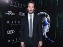 Keanu Reeves attends the Canadian Premiere of The Matrix Resurrections held at Cineplex's Scotiabank Theatre on Dec. 16, 2021. 