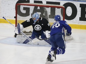 Toronto Maple Leafs Nick Ritchie LW (20) fires a shot off goalie Joseph Woll during practice earlier this week.