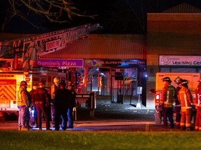 First responders gather at the scene of an explosion aftermath at a strip mall, which included a daycare, at 4769 Kingston Rd. E., near Beechgrove Dr. in Scarborough on Thursday, Dec. 16, 2021.