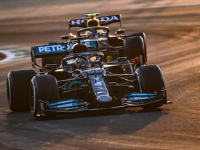 Mercedes' British driver Lewis Hamilton drives ahead of McLaren's British driver Lando Norris during the third practice session of the Formula One Saudi Arabian Grand Prix at the Jeddah Corniche Circuit in Jeddah on Dec. 4, 2021.