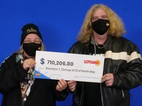 Roseann Timbrell, left, and Trevor Caldwell, both of North Bay, with their Lottario winnings.