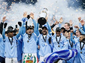 Members of New York City FC celebrate after defeating the Portland Timbers to win the MLS Cup at Providence Park on December 11, 2021 in Portland, Oregon.