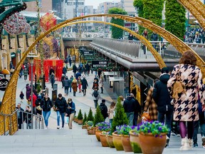 Shoppers walk in the center of Rotterdam, Netherlands, on December 18, 2021.