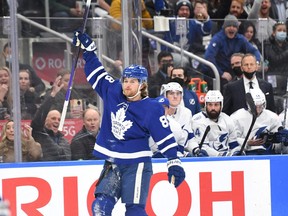 Maple Leafs’ William Nylander, here celebrating a goal against the Lightning, is the 13th Toronto player to be put on the COVID list.