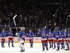 The New York Rangers celebrate the win over the Buffalo Sabres at Madison Square Garden on November 21, 2021 in New York City.