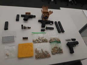 Guns and ammunition seized after suspect Ruxsan Arulrajah, 26, was arrested on Monday, Dec. 13, 2021, for a gunpoint taxi cab robbery a day earlier.