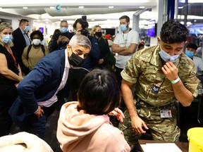 Mayor of London, Sadiq Khan, visits a COVID-19 pop-up vaccination centre at Chelsea football ground, Stamford Bridge in London, December 18, 2021.