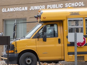 A school bus arrives to pick up students at Glamorgan Junior Public School in Toronto, Tuesday, Nov. 3, 2020.
