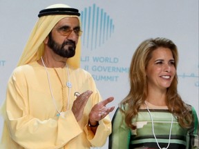 In this file photo taken on Feb. 11, 2018, Sheikh Mohammed bin Rashid al-Maktoum, vice-president and prime minister of the United Arab Emirates and ruler of Dubai, and his wife Princess Haya bint al-Hussein are seen on stage during the opening of the World Government Summit in Dubai.