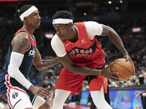 Toronto Raptors forward Pascal Siakam (43) controls the ball as Washington Wizards guard Kentavious Caldwell-Pope (1) tries to defend during the third quarter at Scotiabank Arena.