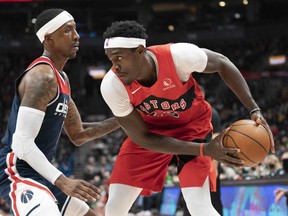 Toronto Raptors forward Pascal Siakam (right) controls the ball as Washington Wizards guard Kentavious Caldwell-Pope (left) tries to defend during yesterday's game at Scotiabank Arena.