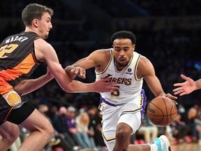Orlando Magic forward Franz Wagner guards Los Angeles Lakers guard Talen Horton-Tucker as he drives to the basket in the first quarter of the game at Staples Center in Los Angeles, Dec. 12, 2021.
