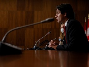 Canada's Prime Minister Justin Trudeau takes part in a news conference in Ottawa on Dec. 13, 2021.