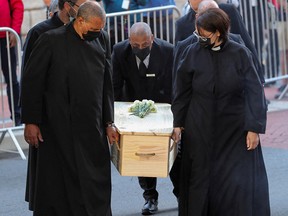 Pallbearers carry the coffin as the casket containing body of late Archbishop Desmond Tutu arrives at St. Georges Cathedral, in Cape Town, South Africa, December 31, 2021.