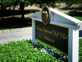 In this file photo taken Aug. 9, 2018 a sign is seen at an entrance to the Trump National Golf Club in Bedminster, New Jersey.