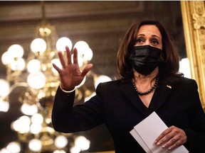 US Vice President Kamala Harris answers a question from a journalist after she swore in Jeff Flake as ambassador to Turkey in the Ceremonial Office of the Eisenhower Executive Building in Washington, DC on December 10, 2021.