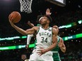 Milwaukee Bucks forward Giannis Antetokounmpo shoots during the second half against the Boston Celtics at TD Garden.