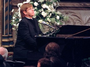 Pop singer Elton John plays a specially re-written version of his classic Candle in the Wind during the funeral service for Diana, Princess of Wales at Westminster Abbey September 6. Millions of people lined the streets of London to watch the funeral procession of the Princess who died in a car crash last week in Paris.
