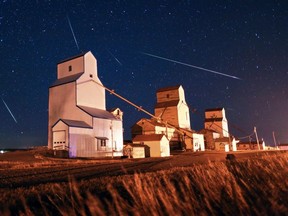 A composite of 4 photographs taken in about a 20 minute period shows Geminid meteors streaking across the sky above the grain elevators of Mossleigh Alberta around midnight on Wednesday December 13, 2017. The Geminid meteor shower was expected to be one of the best of 2017 with up to 120 meteors per hour or 2 every minute.