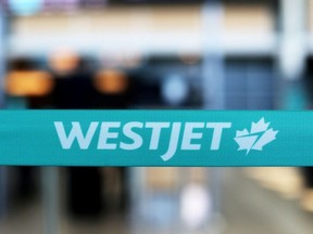 WestJet airline signage is pictured at Vancouver's international airport in Richmond, British Columbia, Canada, February 5, 2019.
