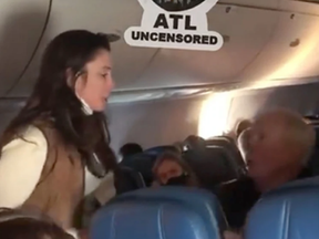 A screengrab from video posted to Twitter of a confrontation on a Delta flight.