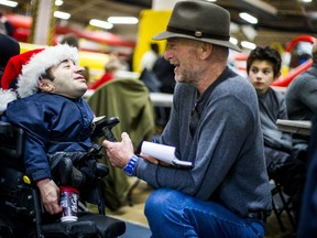 Mike Strobel interviews Don Barrie during the Variety Village Christmas party in Toronto, Ont. on Sunday, Dec. 3, 2017.