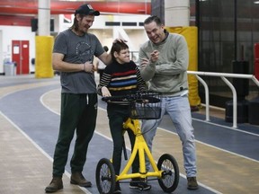 Nancy Enright is pictured at Variety Village while speaking with her two brothers, Anthony (L) and Daniel (R) on Dec. 8, 2021.