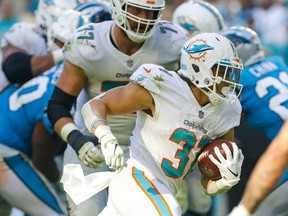 Miami Dolphins running back Phillip Lindsay runs with the football against the Carolina Panthers during the fourth quarter at Hard Rock Stadium.